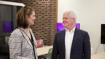 EDUCAUSE president talking with board member