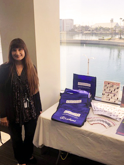 Carol Kiliany pictured with EDUCAUSE marketing collateral at her on-campus meet-and-greet reception