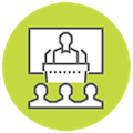 Teaching and Learning icon with teacher at lecturn on stage and audience symbols