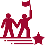 2 people. one is carrying a flag and leading the way
