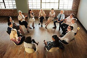 A group of people sitting in a circle