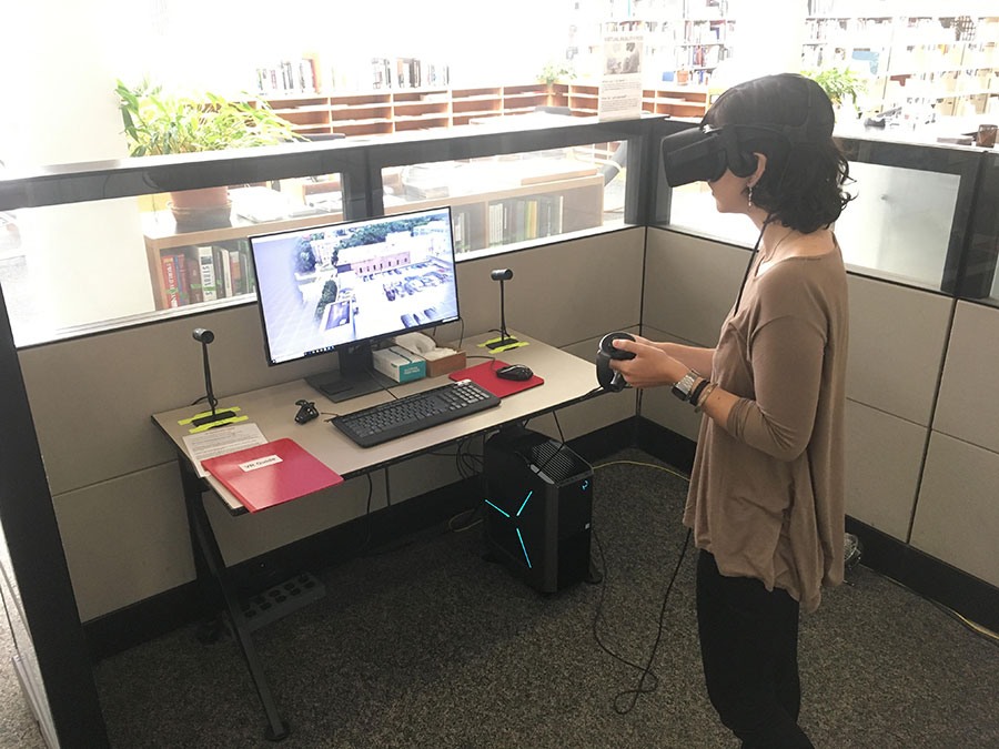 student using XR equipment in a library cubicle