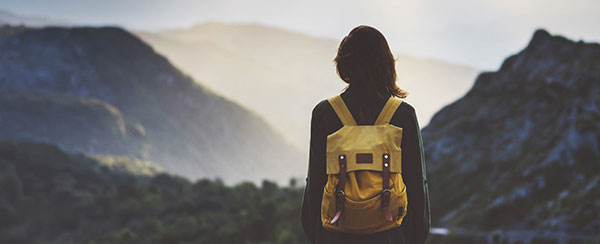 Person looking out over a mountain range