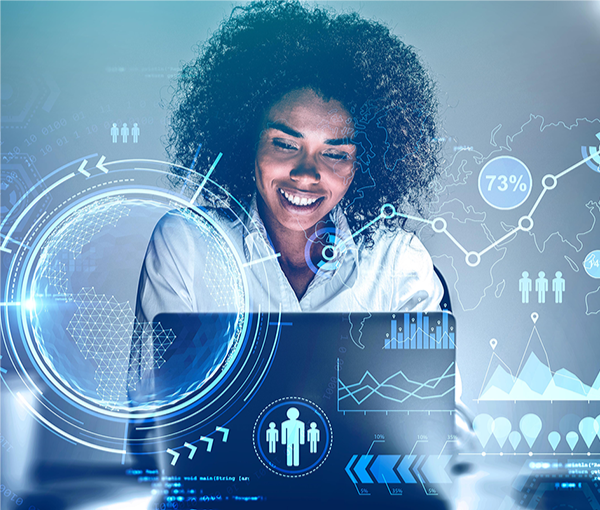 Woman at laptop. Overlay of various types of graphs