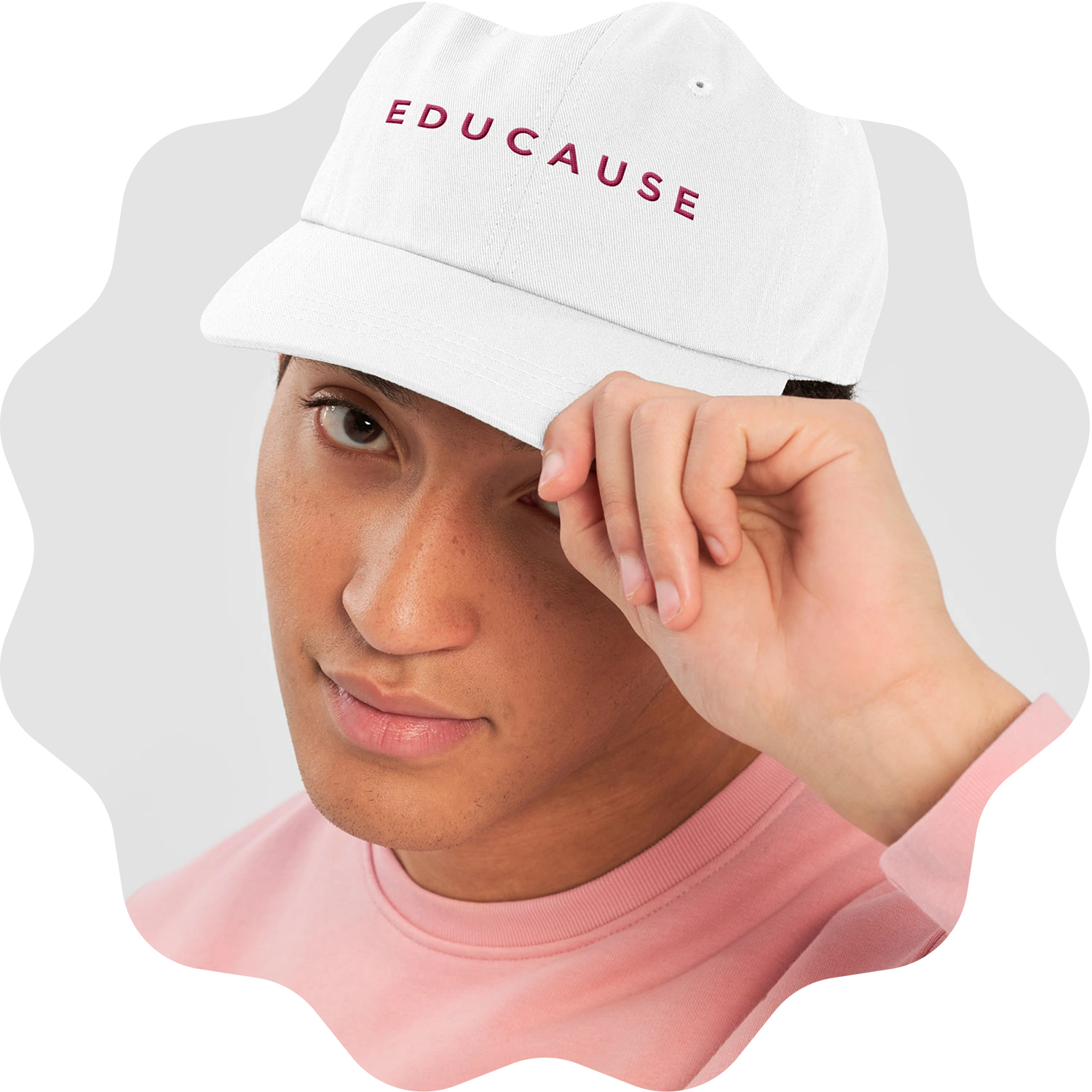 Person wearing a hat that says EDUCAUSE on it.